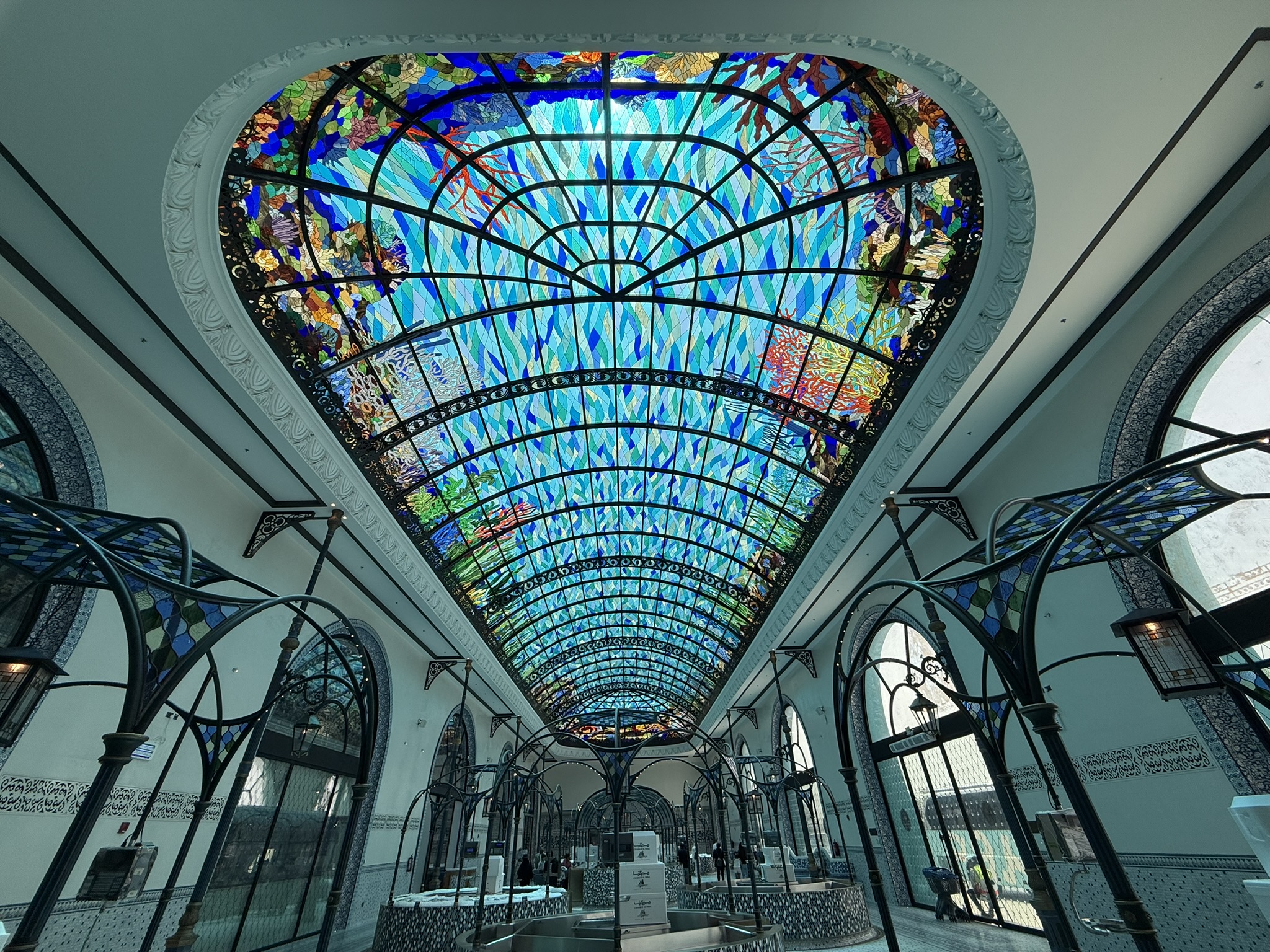 The high blue glass ceiling of the fish market in Doha, Qatar